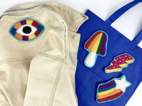 Shirt and bag with rainbow patches.