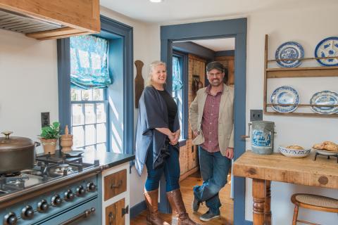 Mike Lemieux and Jen Macdonald standing in a restored kitchen