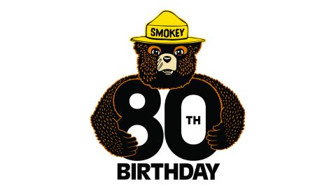 Smokey Bear holding the number 80 with the word birthday underneath.