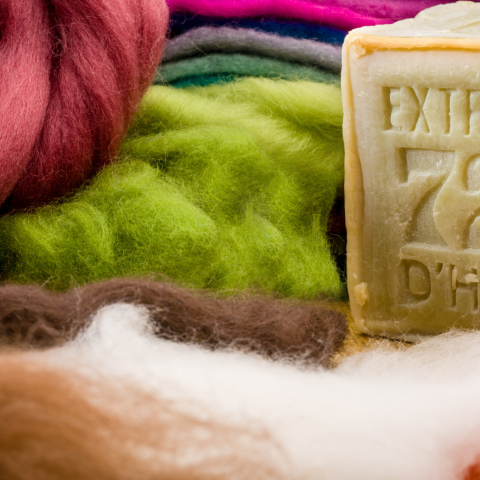 Colored wool and a bar of soap