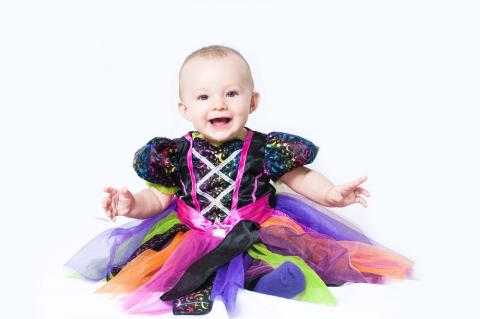 Baby in Halloween dress.  