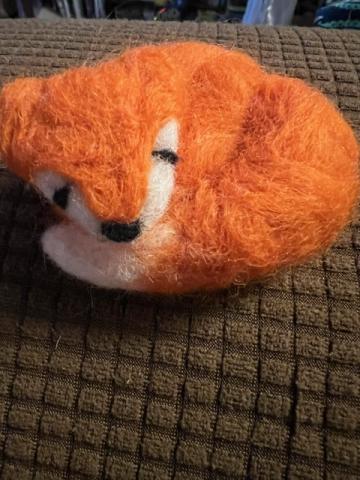 Needle felted fox laying down